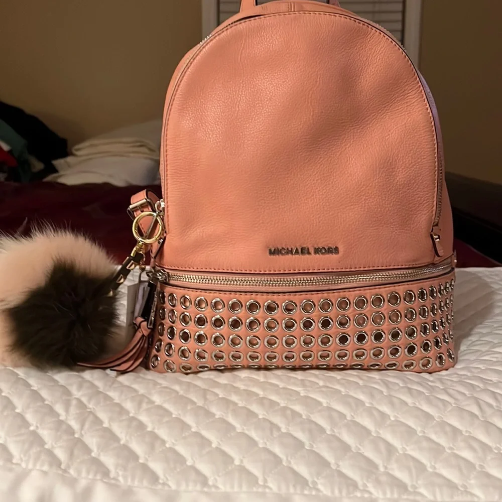 Michael Kors Rhea Medium Silver-Ringed Backpack with Fur Pompom in Coral…